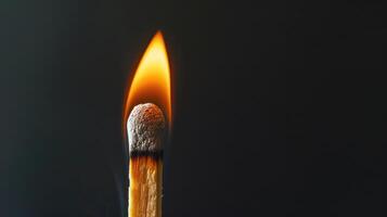 AI generated Witness the fiery intensity of a burning wooden match against a black background, a captivating and dramatic scene. Ai Generated. photo