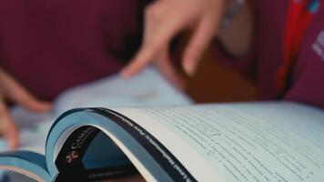 Person reading a magazine with focus on the text. video