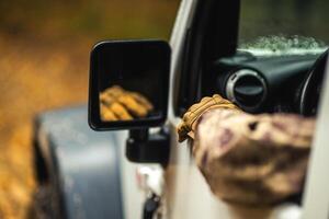 Hunter Driving Along Wilderness Looking For a Game photo