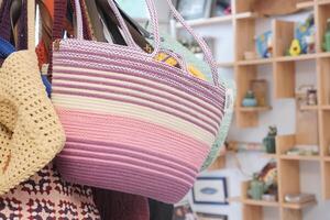 woolen pink and purple striped bag in a store photo