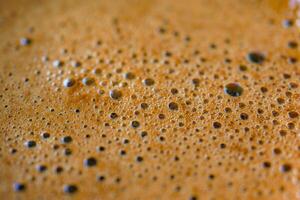 Closeup of hot coffee with bubble photo