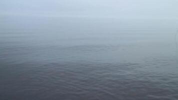 thick white fog over a calm sea, calm, silence, nothing visible, background video