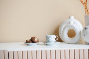 chocolate sweet cookies and coffee cup on decorative table photo