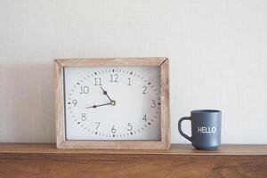 simple modern clock on table photo