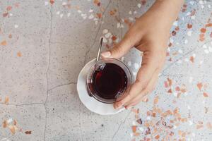 top view of women hand pick Traditional turkish tea photo