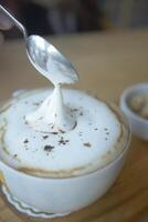 Coffee cup on wood table photo