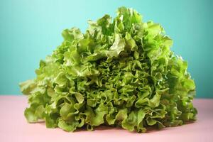 green lettuce leaves on a chopping board on table photo