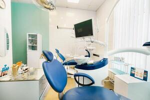 An empty chair in the dentist's office. Empty dentist's office photo