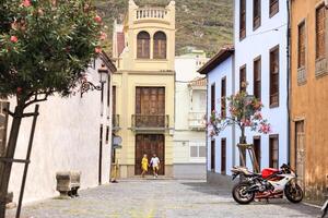 a modern married couple of lovers strolling in the old town of the island of Tenerife, a couple of lovers in the city of LA Laguna photo