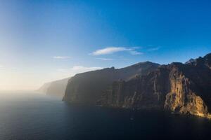Top view of the Giant Rocks of Acantilados de Los Gigantes at sunset, Tenerife, Canary Islands, Spain photo