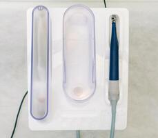 Ultrasonic scaler in the dental office. Dentistry Concept photo