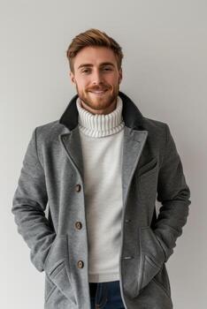 AI generated Portrait of a stylish man in an autumn grey coat on a white background photo