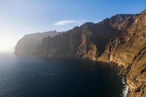 Top view of the Giant Rocks of Acantilados de Los Gigantes at sunset, Tenerife, Canary Islands, Spain photo