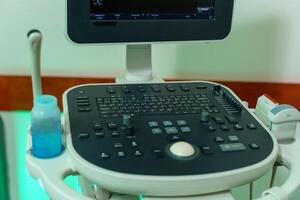 Medical equipment ultrasound scanning. Diagnosis. Focus on keyboard. photo