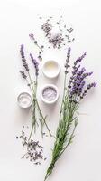 ai generado plano laico con piel cuidado productos con Fresco aromático lavanda flores parte superior vista. foto