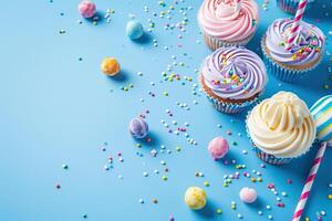 AI generated Blue table top on blue background with decorated lollipops and cupcakes, children birthday party photo