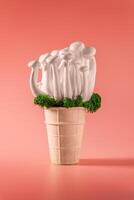 shimeji mushrooms with green moss in an ice cream cone, on peach fuzz background photo