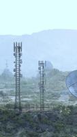 An array of surveillance antennas in a grassy field at an observatory video
