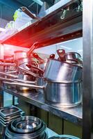 Professional cooking equipment. Restaurant steel kitchen workplace. photo