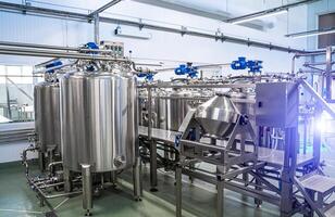 Interior of dairy factory with fermentation tank. Technology equipment at dairy farm. Sterile production. photo