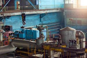 Machine room in thermal power plant with electric generators and turbines photo