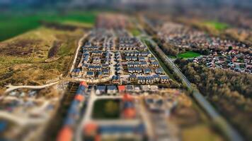 Aerial view of a suburban neighborhood with tilt-shift effect, creating a miniature scene appearance in Harrogate, North Yorkshire. photo