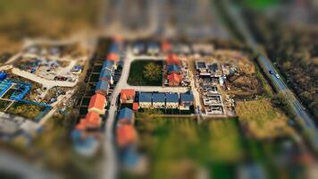 Tilt-shift aerial view of a residential neighborhood, giving a miniature effect to the houses and streets in Harrogate, North Yorkshire. photo