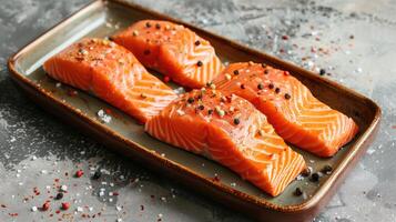 AI generated Plate with raw salmon fillets and spices on grey table, closeup photo