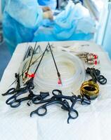 Surgical instruments located on a white table. Medical equipment for neurosurgery. Laparoscopic equipment. Close-up photo