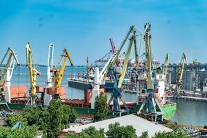 Logistics business. Huge cranes and containers, sunny summer day. International port. Logistics business. photo