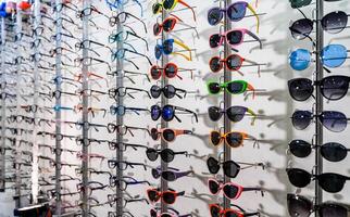 Eyeglasses show products on the shelf. Glasses multiple design. photo