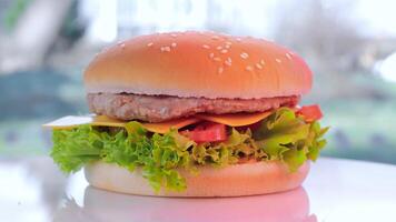 Beef Burger With Cheese Rotating Close-up. Fast Food. A Quick Snack. video