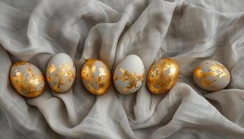 AI generated Golden Easter eggs on a white linen background. Happy Easter. photo