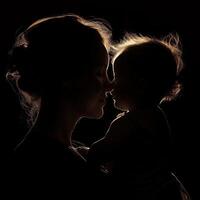 AI generated Silhouette of a mother and her daughter on a black background. Mother's day photo