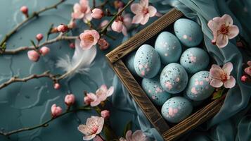 AI generated Easter eggs painted in pastel colors in a wooden box on a blue background with pink flowers. photo