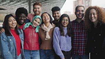 Happy multiracial group of diverse friends hang out in the city - Young people lifestyle concept video