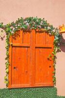 orange color wooden door texture background photo