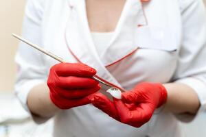 Doctor in medicine uniform. Nurse holding medical equipment. photo