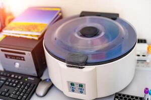 Modern automatic machine for centrifuge blood and urine testing. Closeup photo