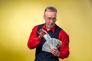 Portrait of very excited man with bunch of money. Lucky day. Human emotions and facial expressions photo