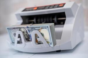 Finance business money counting. Bank cash counter machine. photo