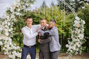 Wedding photography. The groom and his friends photo