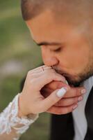 a man kisses a woman's hand. manifestation of love. He proposes to her. She said yes. Close-up photo