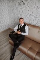 Portrait of smiling successful Caucasian man in formal suit, posing in room, happy young male boss or CEO looking at camera, showing confidence and strength, leadership concept photo