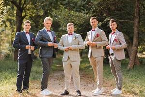 Wedding photography. The groom and his friends photo