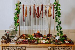 Cossack table. Banquet hall Meat treats for guests. Homemade cutouts. Pork tenderloin. Delicious meat cuts. Meat plate. Delicious compositions from smoked mint. Cottage cheese. photo