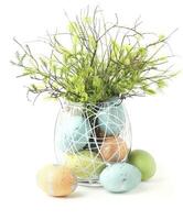 AI generated Easter eggs decoration in a glass oval container isolated  on white background photo