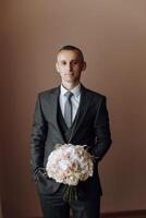 Portrait of smiling successful Caucasian man in formal suit, posing in room, happy young male boss or CEO looking at camera, showing confidence and strength, leadership concept photo