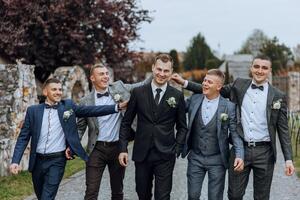 Wedding photography. The groom and his friends photo