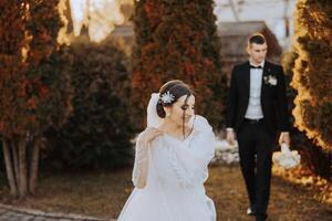 The moment of the first meeting of the bride and groom with a wedding bouquet, the bride is waiting for her lover. photo